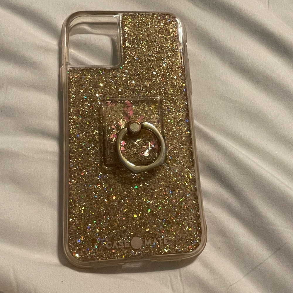 Iphone 11 phone case. Gold and sparkly, with ringlet on the back.
